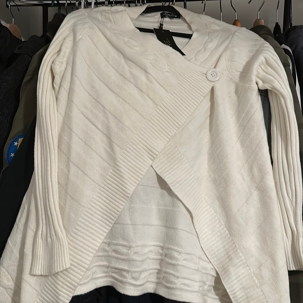 It a white a sweater from be mine.